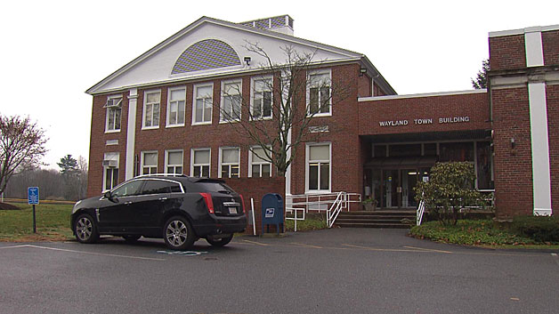 Police say some fliers were placed at Wayland Town Hall. (WBZ-TV)