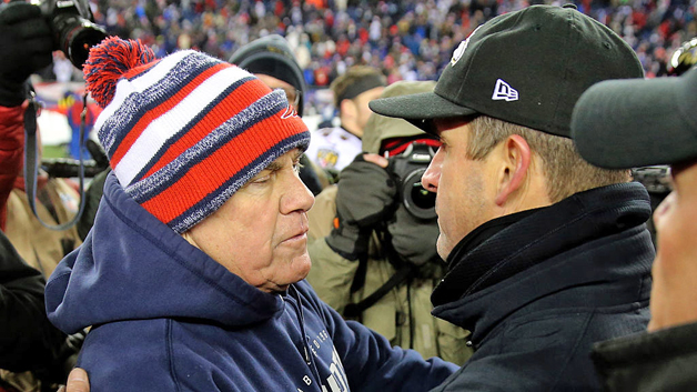 Bill Belichick greets John Harbaugh after the Patriots defeated the Ravens in the 2014 divisional round. (Photo by Jim Rogash/Getty Images)