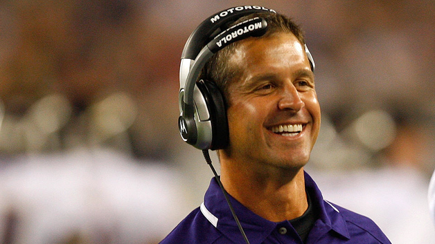 John Harbaugh smiles in his first game as Ravens head coach, a preseason game at Gillette Stadium against the Patriots in August 2008. (Photo by Jim Rogash/Getty Images) 