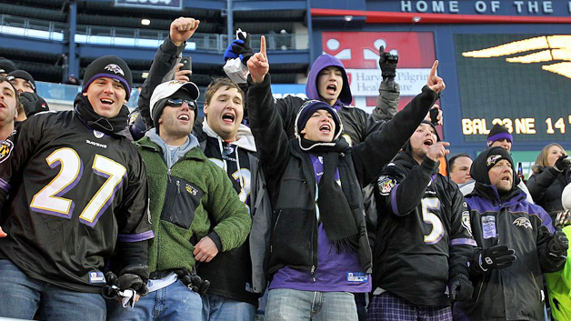 Ravens fans celebrate the team's playoff win at Gillette Stadium. (Photo by Jim Rogash/Getty Images)