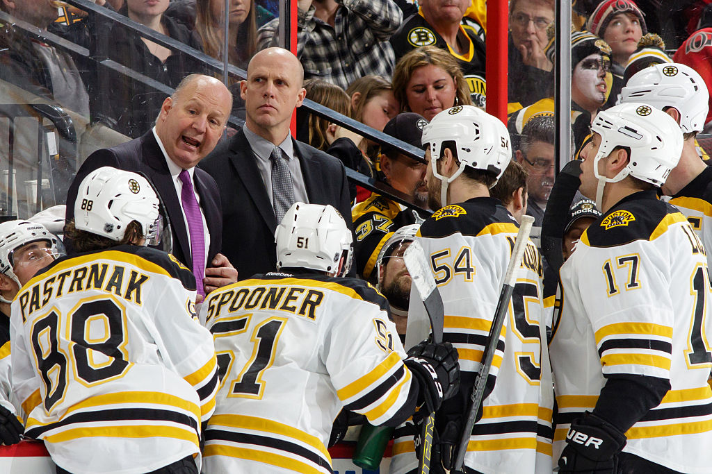 Head coach Claude Julien talks to Boston Bruins players during a time-out against the Ottawa Senators on March 10, 2015. (Photo by Jana Chytilova/Freestyle Photography/Getty Images)