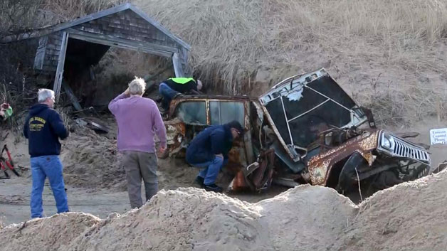 Jeep buried with garage in sand dune on Ballston Beach. (WBZ)