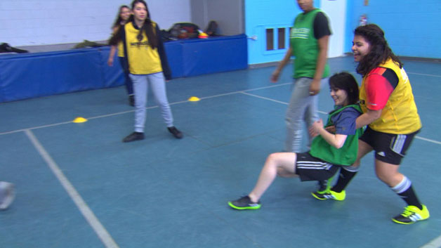 Players having fun during a game at Soccer Without Borders (WBZ)